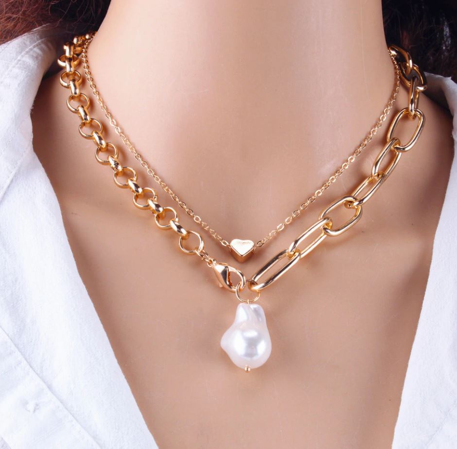 картинка Ожерелье из двух цепочек с подвесками бусина и сердце, цвета золота от магазина El Corazon
