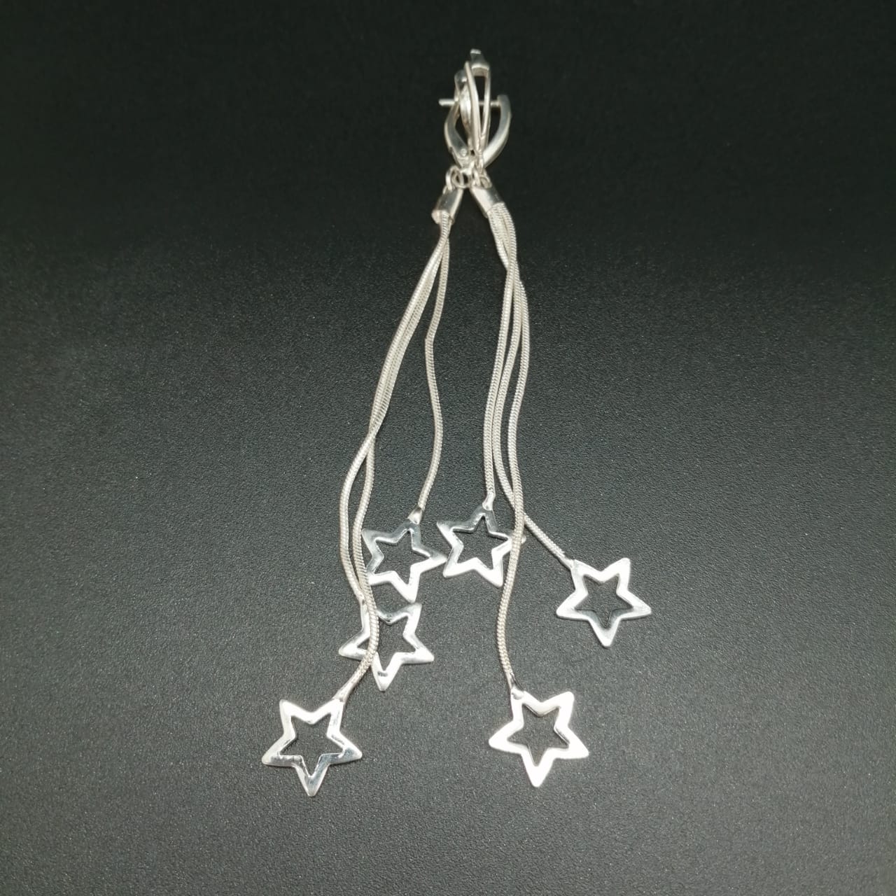 картинка Серьги звездочки на цепочке из серебра от магазина El Corazon