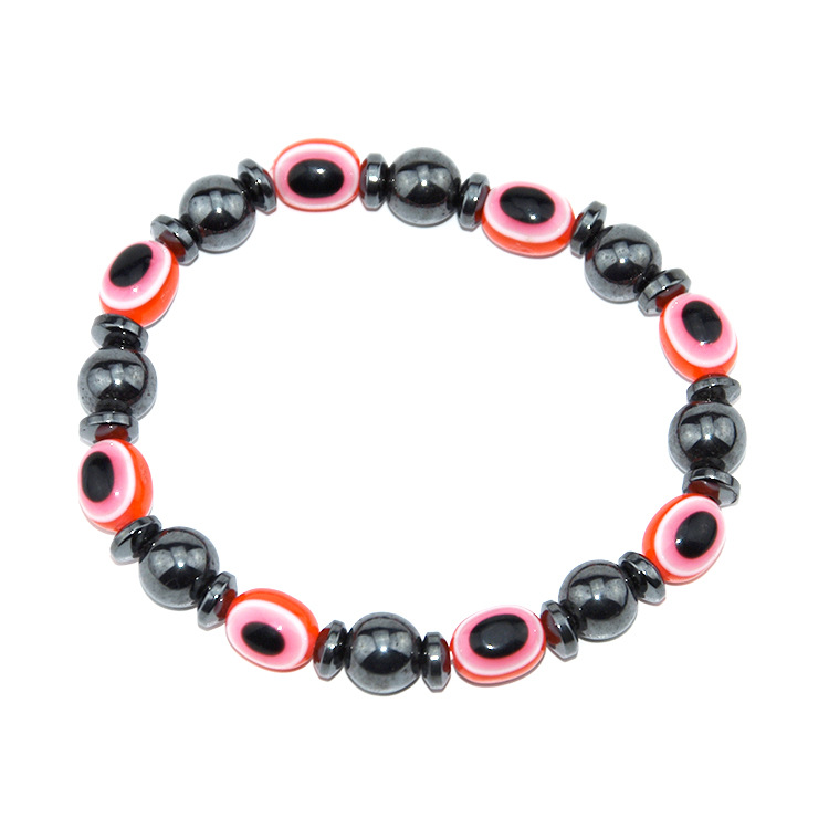 картинка Черный магнитный браслет для похудения с красными камнями от магазина El Corazon