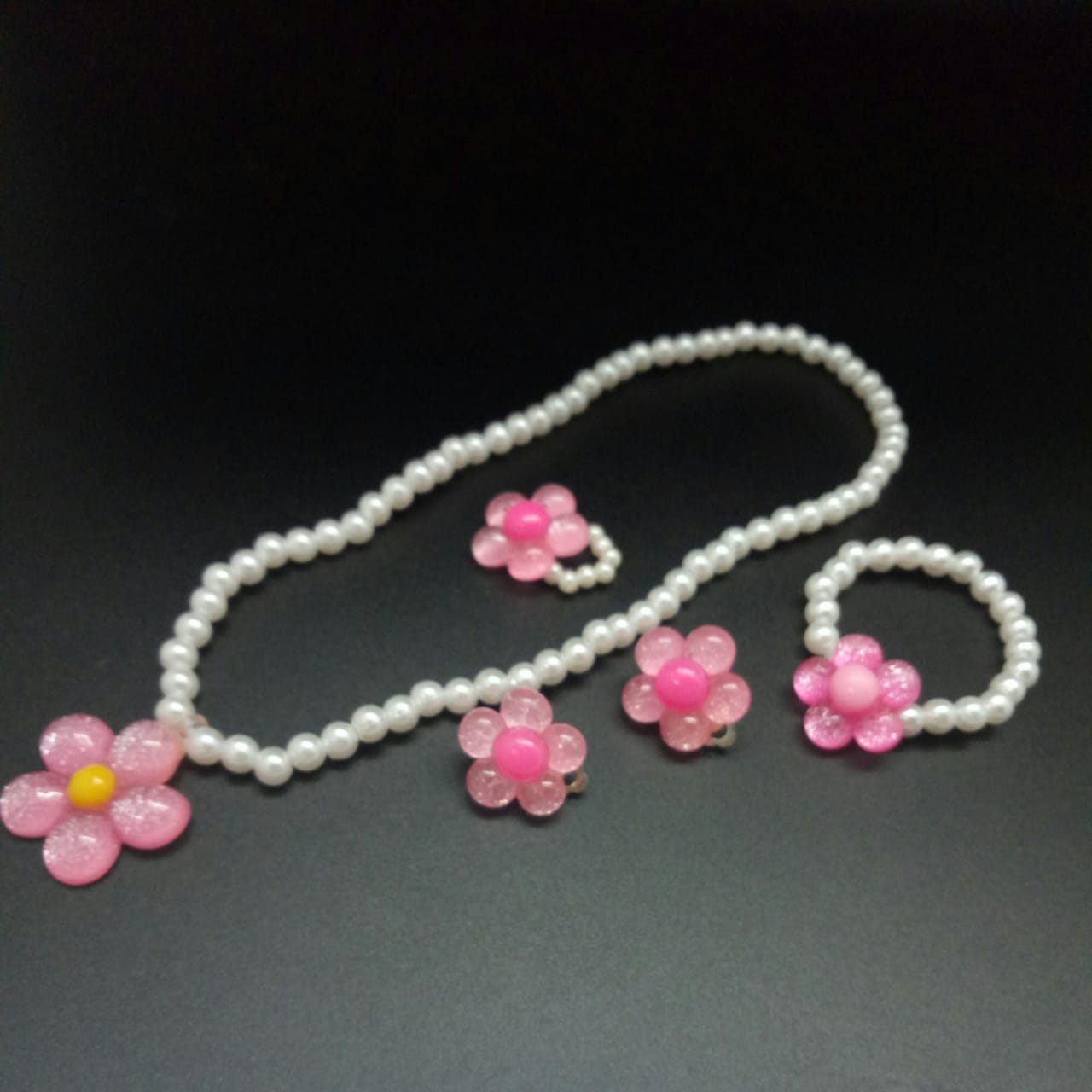 картинка Набор: Ожерелье, браслет, кольцо, серьги - клипсы Цветочки от магазина El Corazon